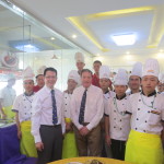 Dr Ng and Dr Tempest-Mogg posing with student chefs