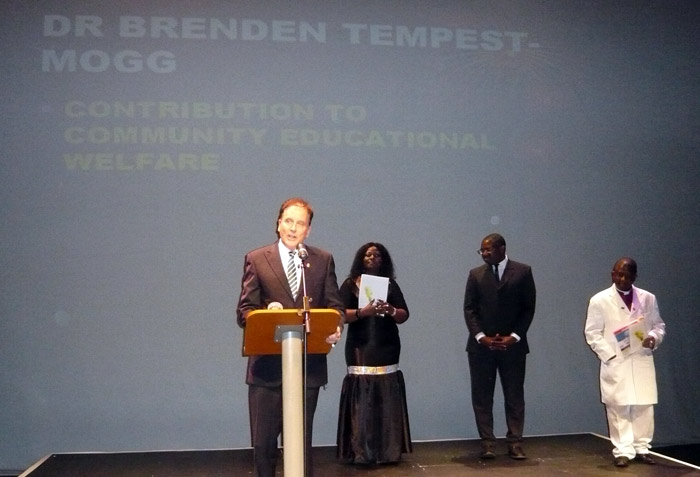 Dr Brenden Tempest-Mogg receiving the RECON 2009 Leadership Award. Archbishop Kwaku Frimpong-Manson is in white, standing next to then Minister of Education, David Lammy, MP.