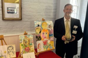 Simon Partridge shows off some of his artwork